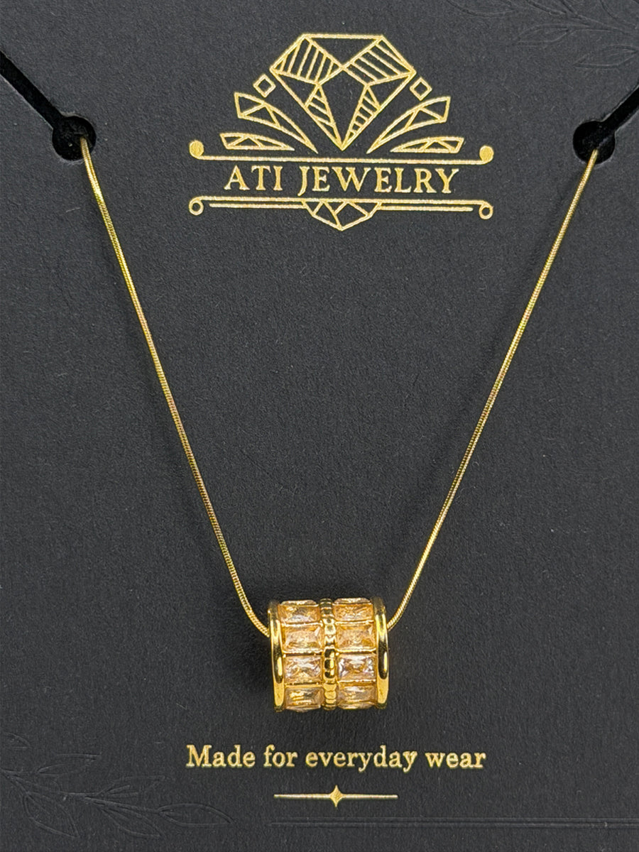 The Crystal Barrel Necklace in 18K Gold Finish with clear faceted crystals