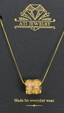 The Crystal Barrel Necklace in 18K Gold Finish with clear faceted crystals