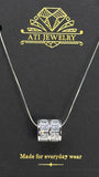 The Crystal Barrel Necklace in Polished Stainless Steel with clear faceted crystals