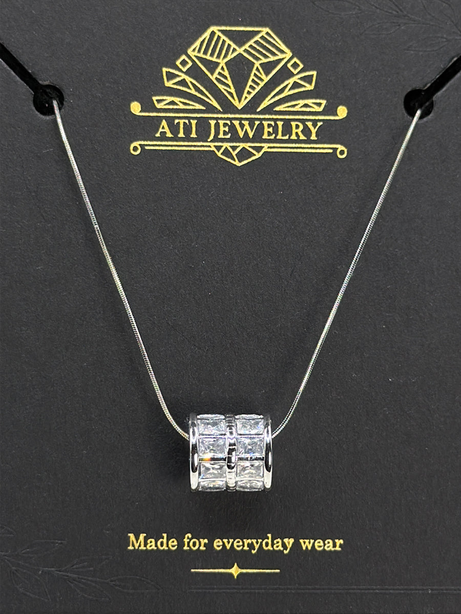 The Crystal Barrel Necklace in Polished Stainless Steel with clear faceted crystals
