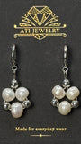 The Pearl Clover Earrings in Polished Stainless Steel with 7–8 mm freshwater pearls
