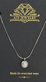 The Elara Necklace in polished stainless steel finish with clear crystal charm on ATI Jewelry card