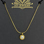 The Elara Necklace in 18K gold finish with clear crystal charm on ATI Jewelry card