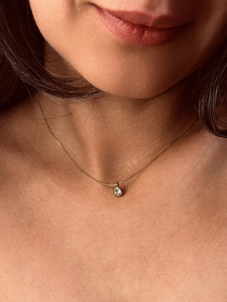 The Elara Necklace in 18K gold finish with clear crystal Elara charm