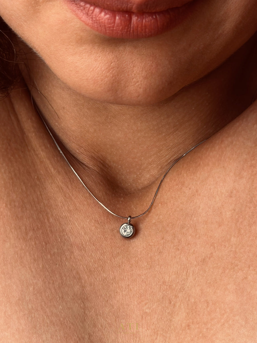 The Elara Necklace in polished stainless steel finish with clear crystal Elara charm