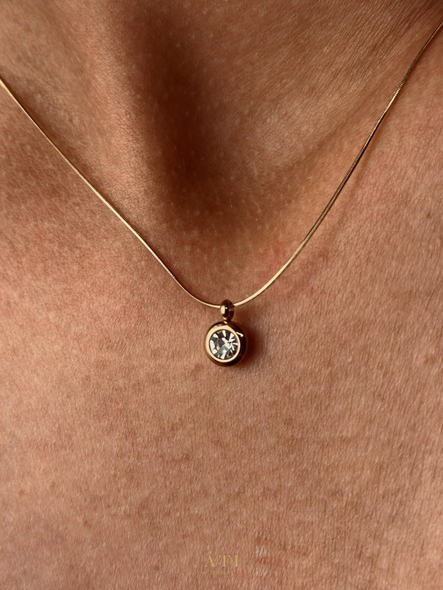 The Elara Necklace in 18K gold finish with clear crystal Elara charm