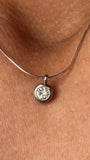 The Elara Necklace in polished stainless steel finish with clear crystal Elara charm