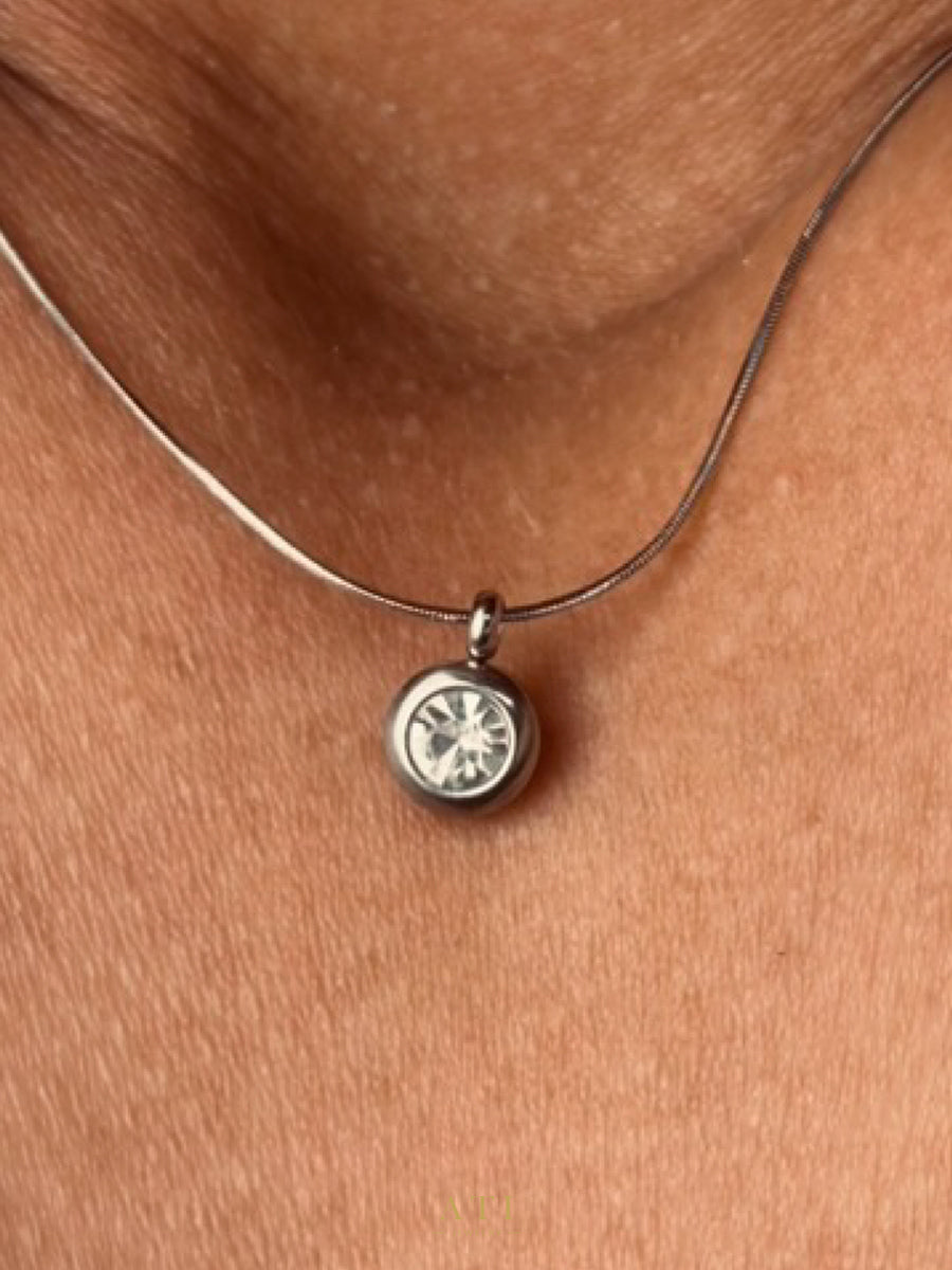 The Elara Necklace in polished stainless steel finish with clear crystal Elara charm
