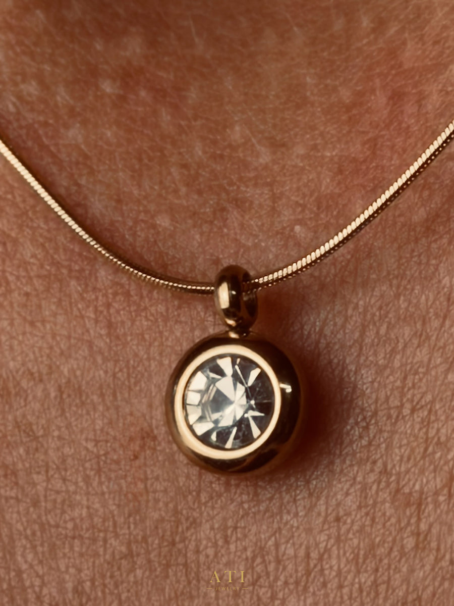 The Elara Necklace in 18K gold finish with clear crystal Elara charm