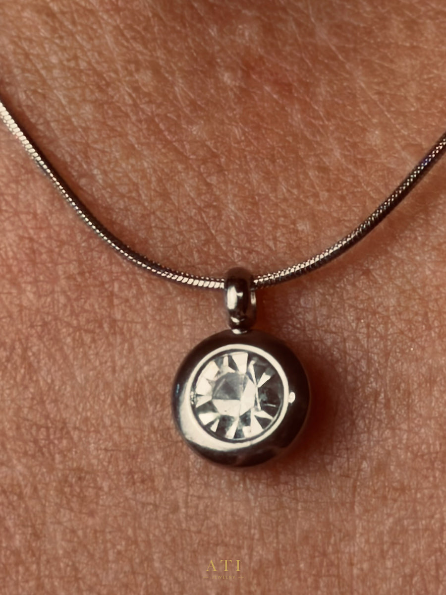 The Elara Necklace in polished stainless steel finish with clear crystal Elara charm