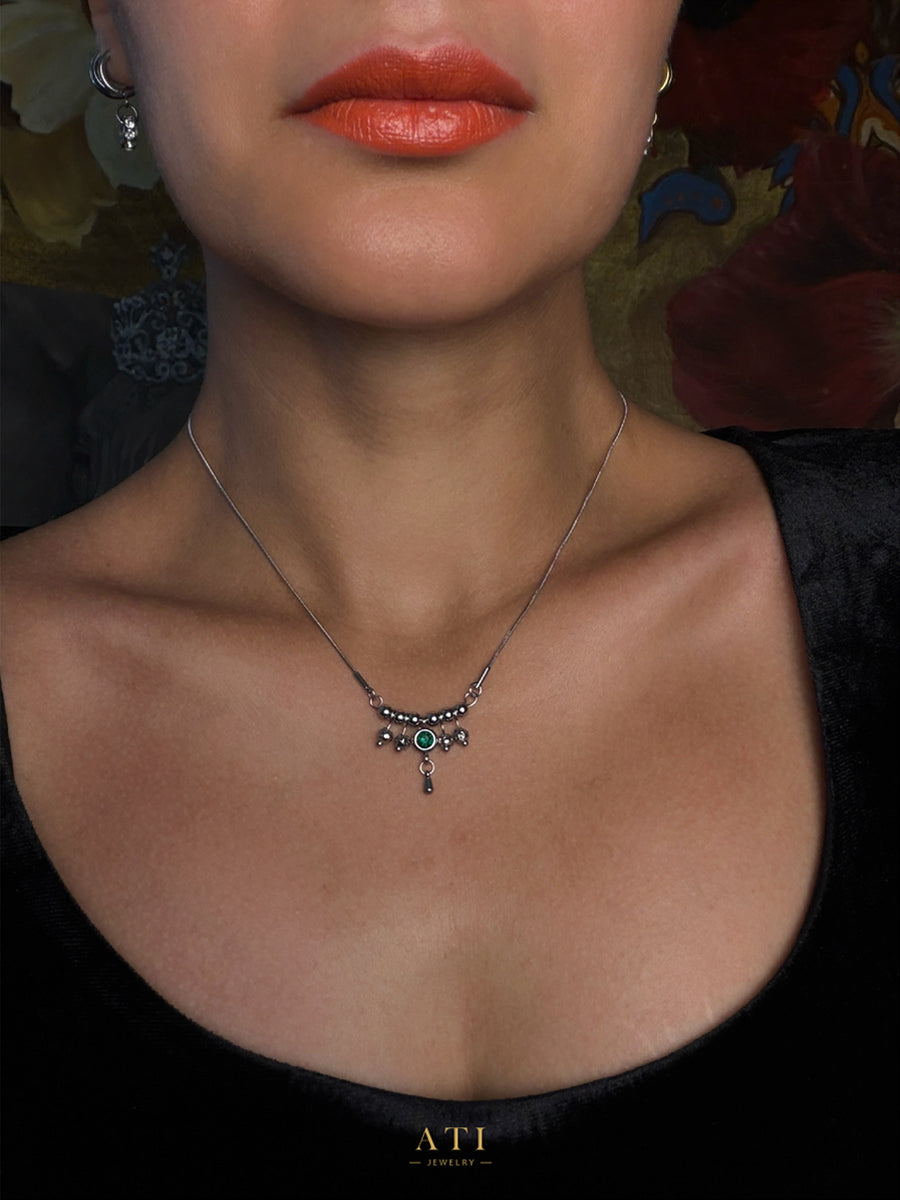 Silver-tone Queen Necklace with Emerald Green crystal centerpiece and suspended details