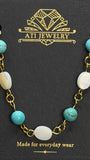 The Shoreline Necklace with white shell and turquoise beads in 18K Gold Finish