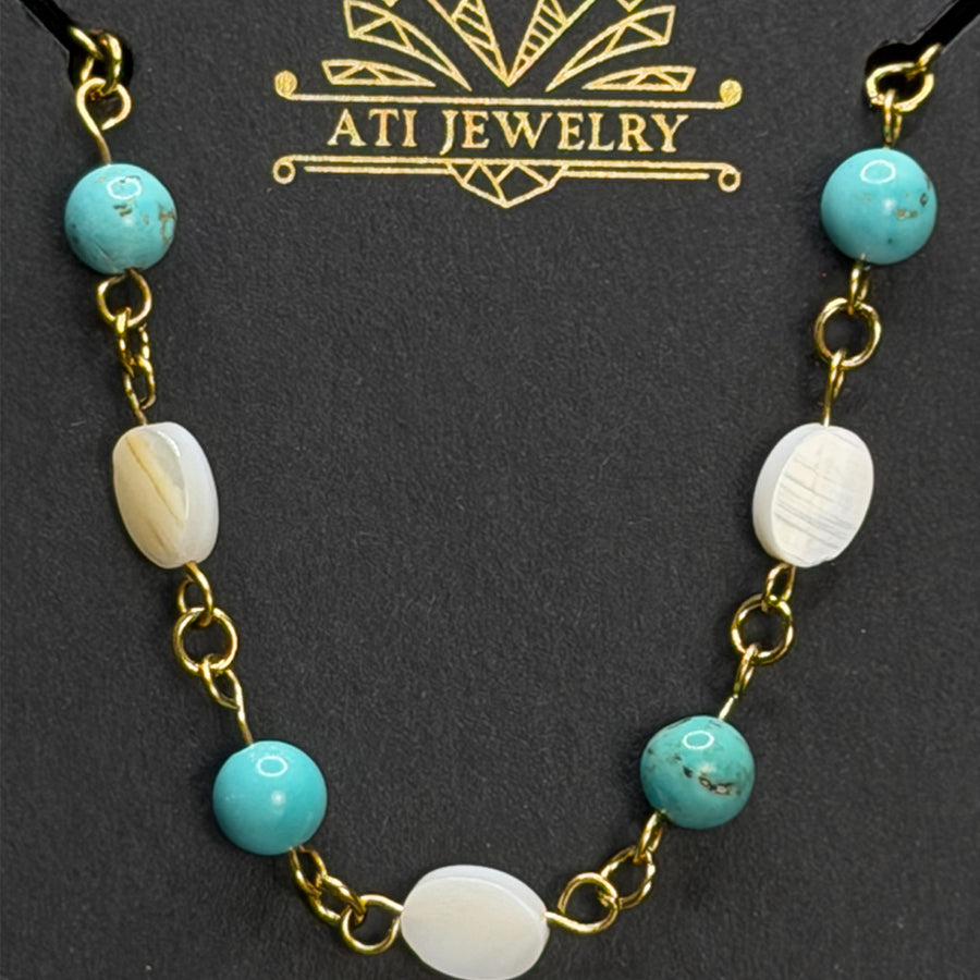 The Shoreline Necklace with white shell and turquoise beads in 18K Gold Finish