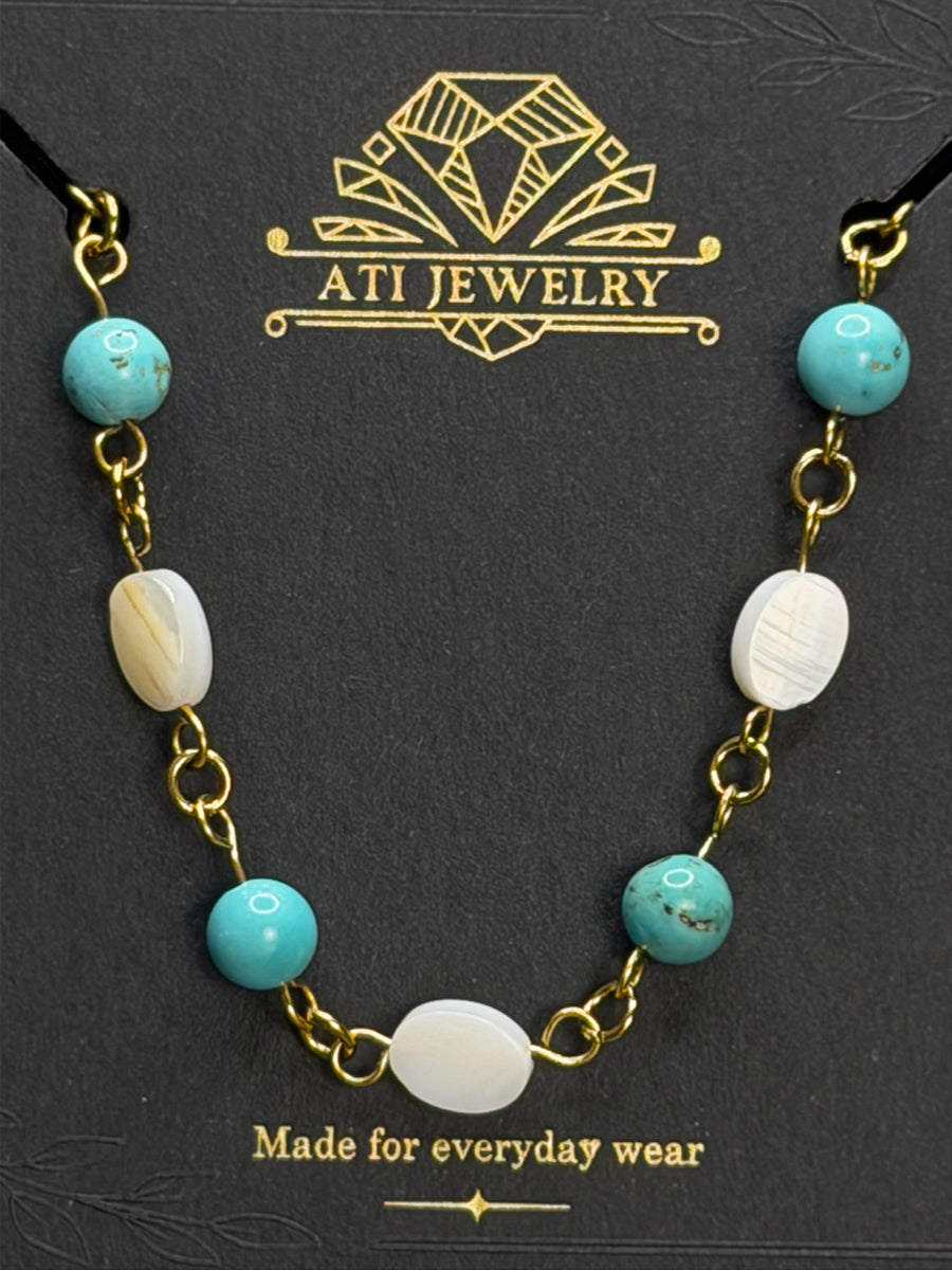 The Shoreline Necklace with white shell and turquoise beads in 18K Gold Finish
