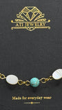 The Shoreline Bracelet with white shell and turquoise beads in 18K Gold Finish