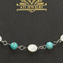 The Shoreline Bracelet in Polished Stainless Steel with shell and turquoise beads